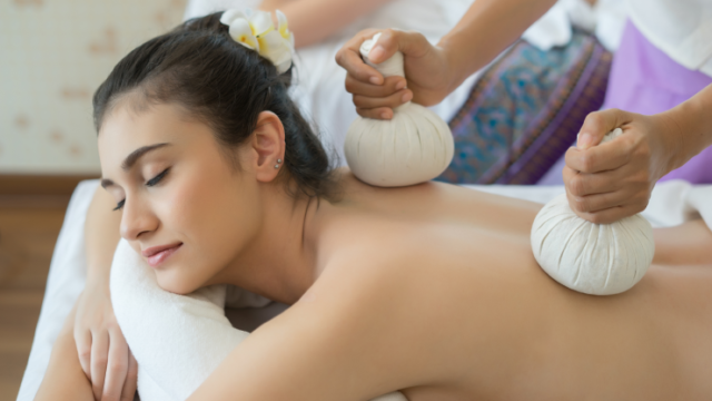 young-beautiful-woman-relaxing-massage-spa-salon